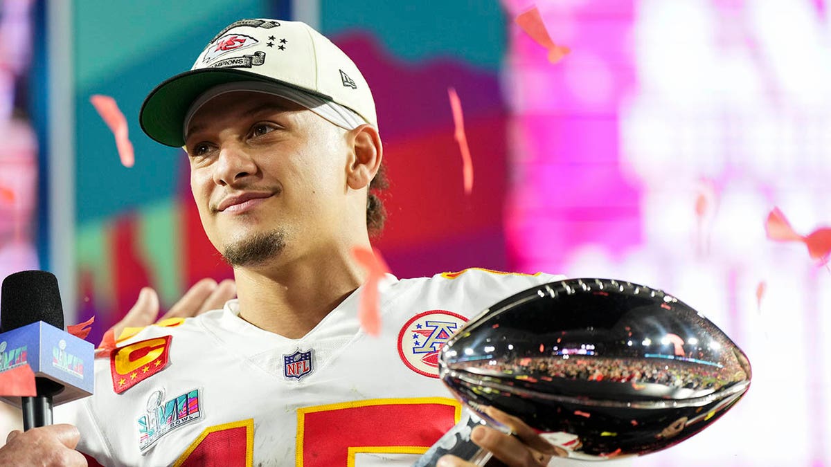 Patrick Mahomes with Lombardi trophy