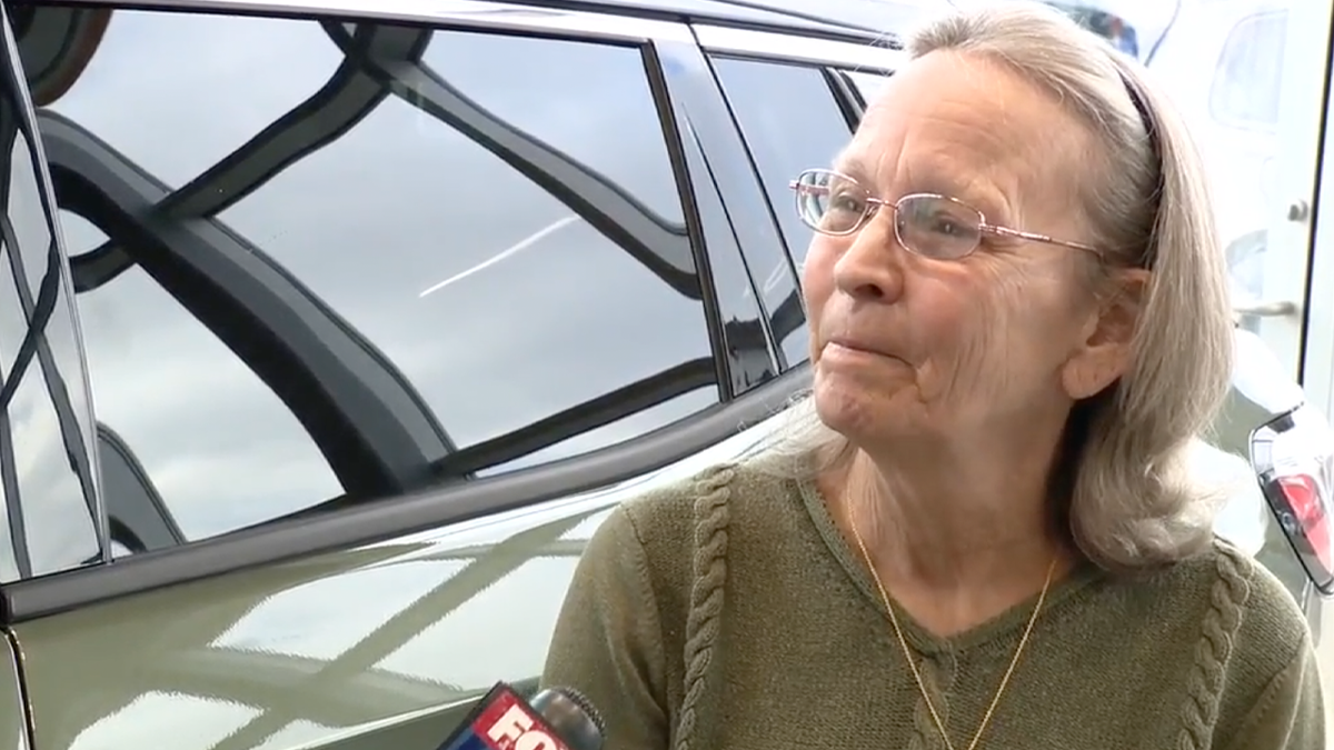 Michigan grandma Diane Gordon in front of her new Jeep