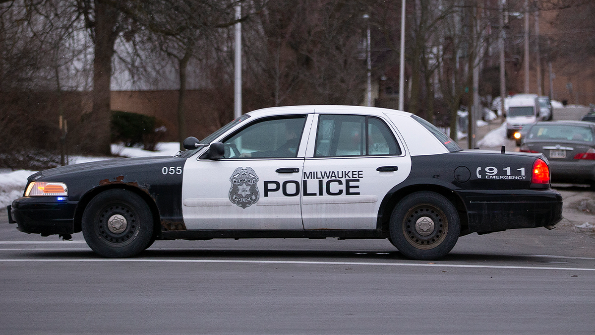 Milwaukee police cruiser at crime scene