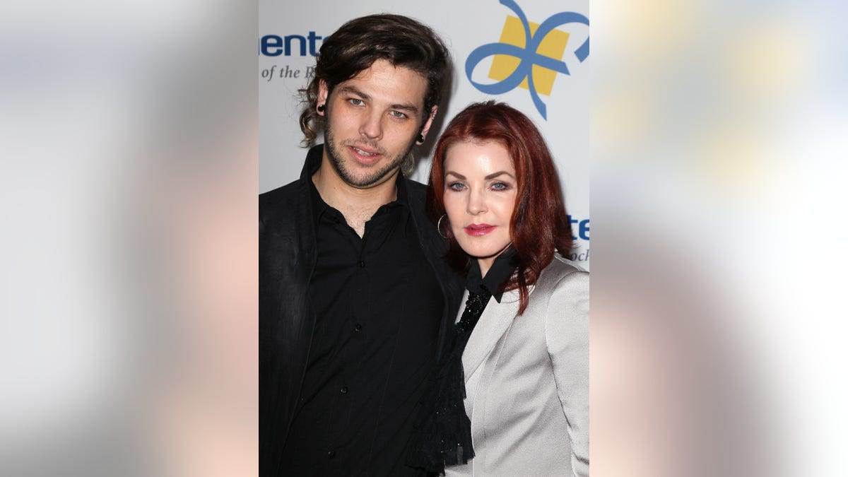 Priscilla Presley takes a photo standing next to her son, Navarone Garcia.