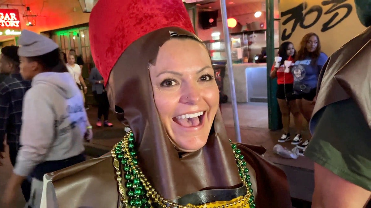 Woman dressed as bottle of Fireball at Mardi Gras in New Orleans