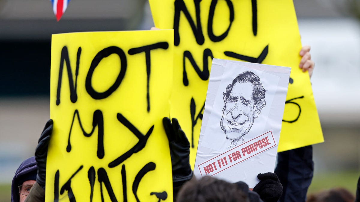 Protesters holding not my king signs