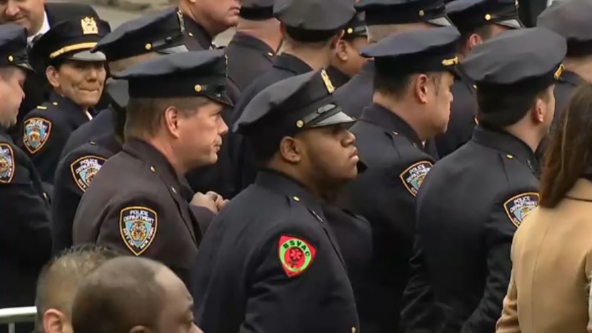 officers outside funeral