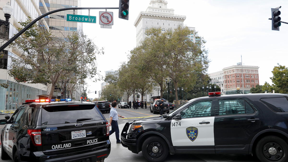 Oakland police cars in intersection