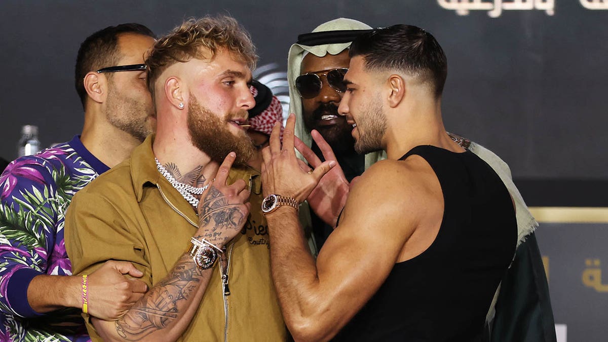 Jake Paul and Tommy Fury at conference