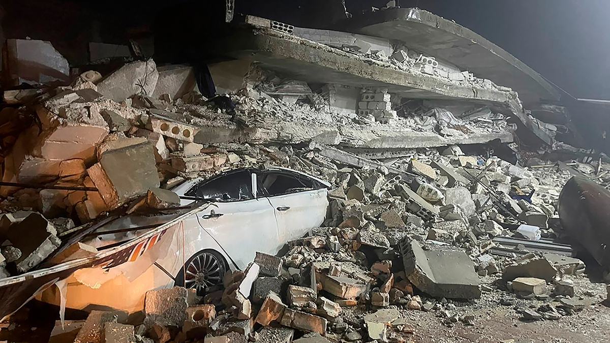 Car under rubble in Syria