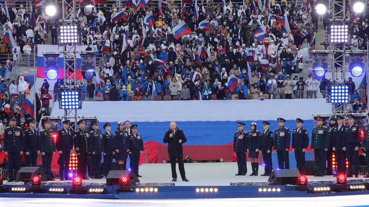 Russian President Vladimir Putin speaks during a concert in Luzhniki Stadium