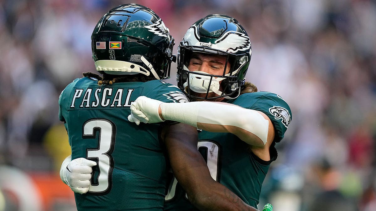 Philadelphia Eagles wide receiver Zach Pascal (3) embraces tight end Jack Stoll