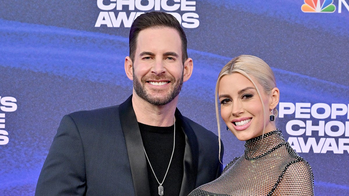 Tarek El Moussa and Heather Rae Young smiling