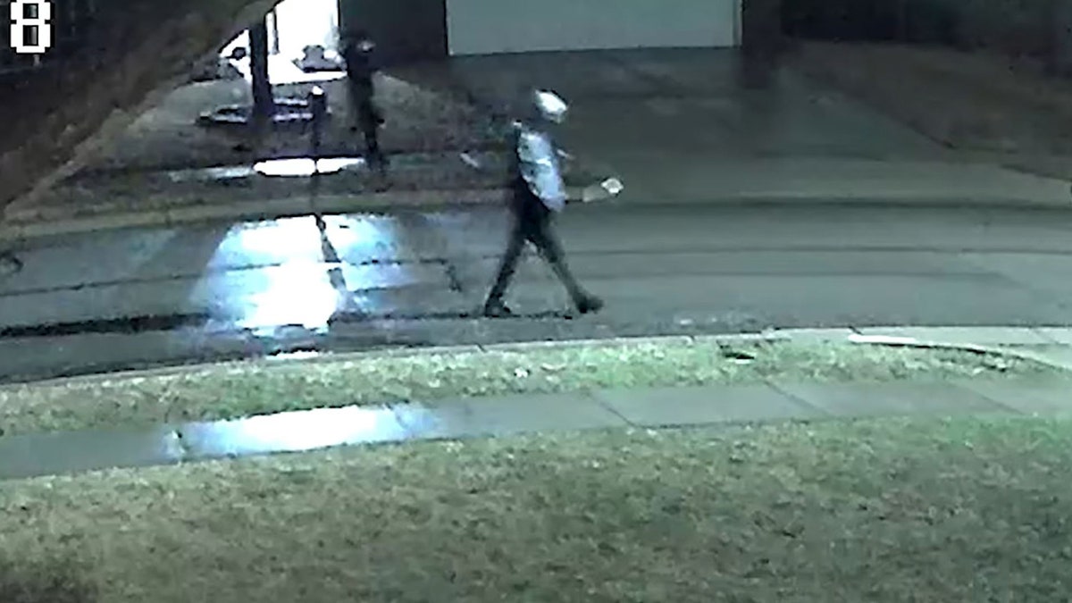 suspects walking down dark street