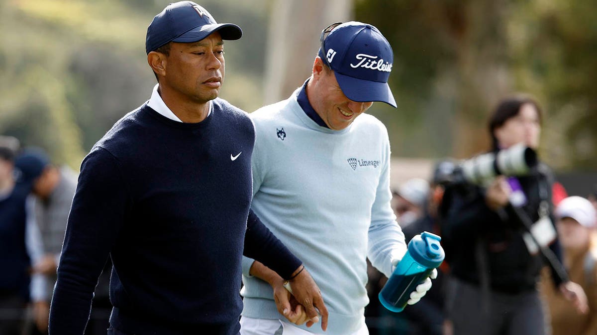 Tiger and Justin Thomas walking