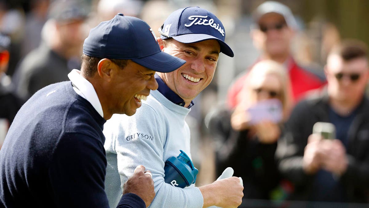 Tiger and Justin Thomas laugh