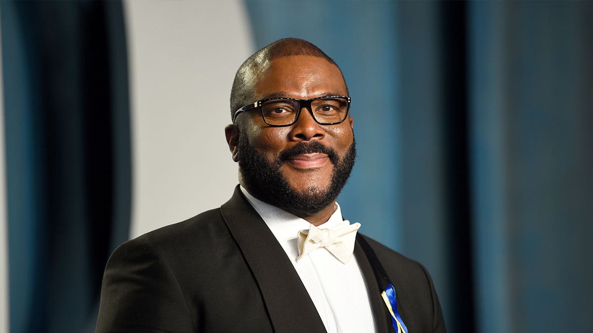 Tyler Perry smiling in a tux