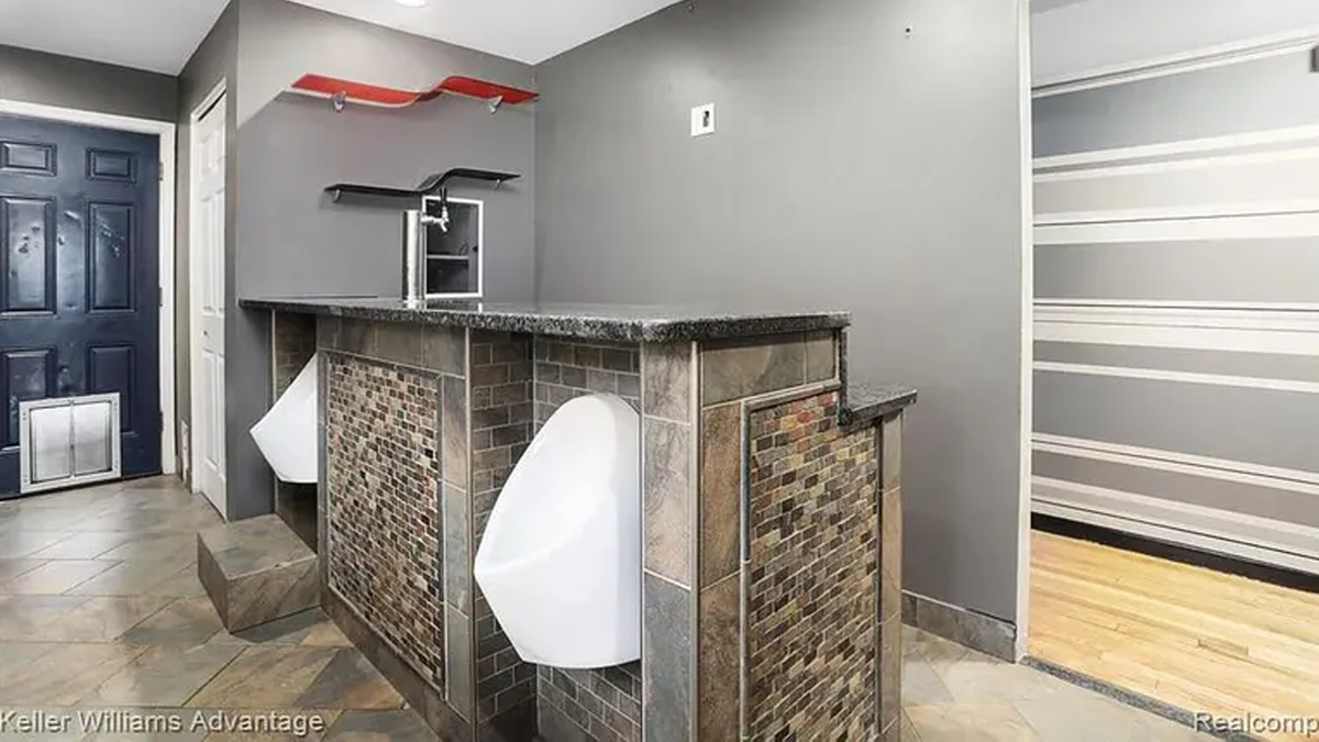 Home kitchen with two urinals