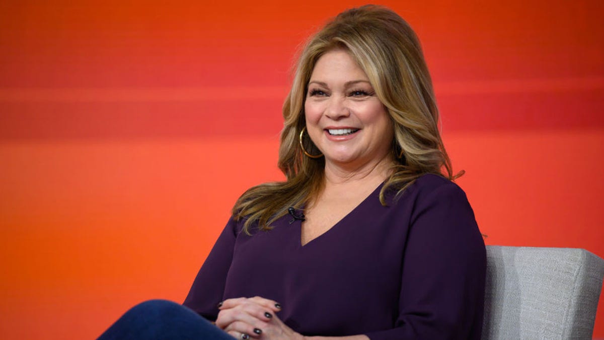 Valerie Bertinelli sitting on set