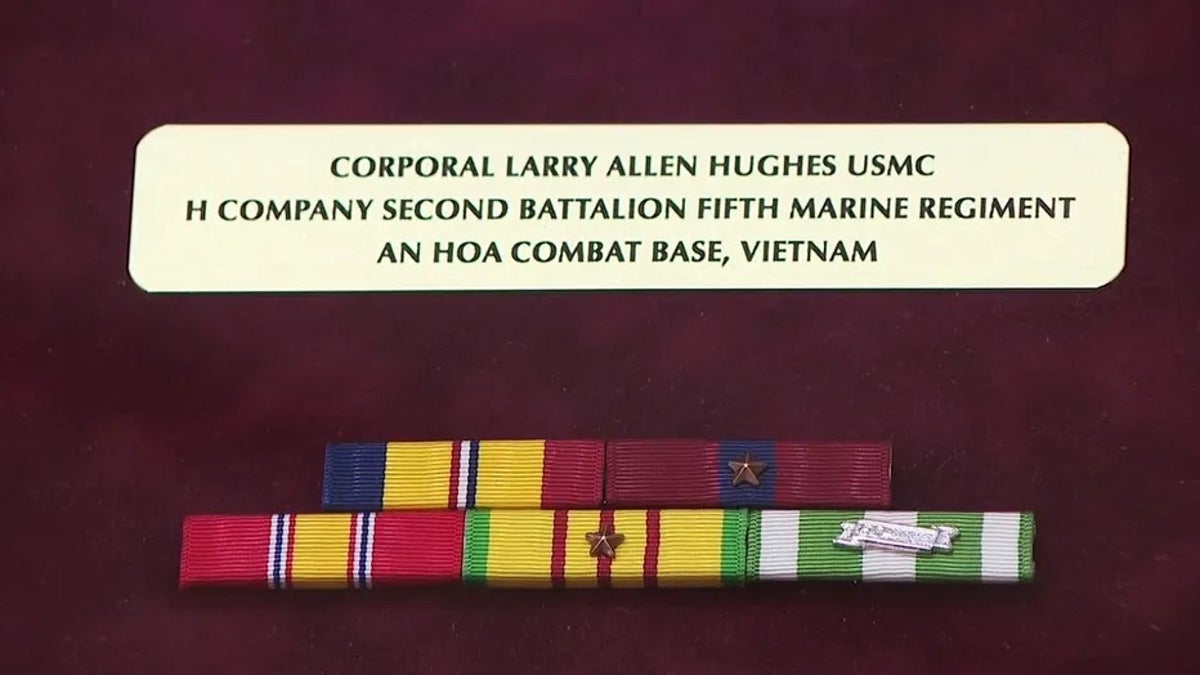 Corporal Larry Hughes plaque