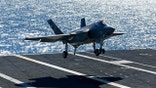 U.S. Navy test Pilot Tony Wilson makes the first ever landing of the F-35C