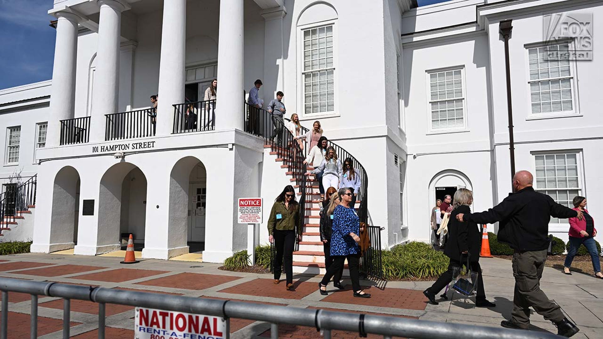 People evacuate a courthouse.