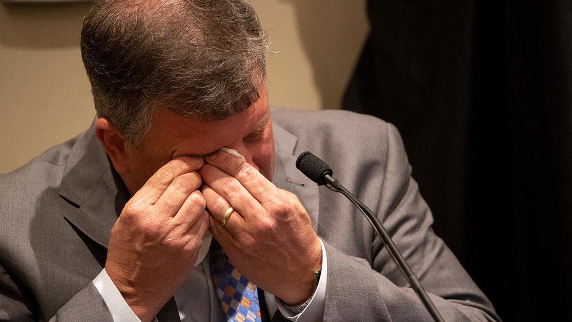 Maw wipes tears away from his eyes