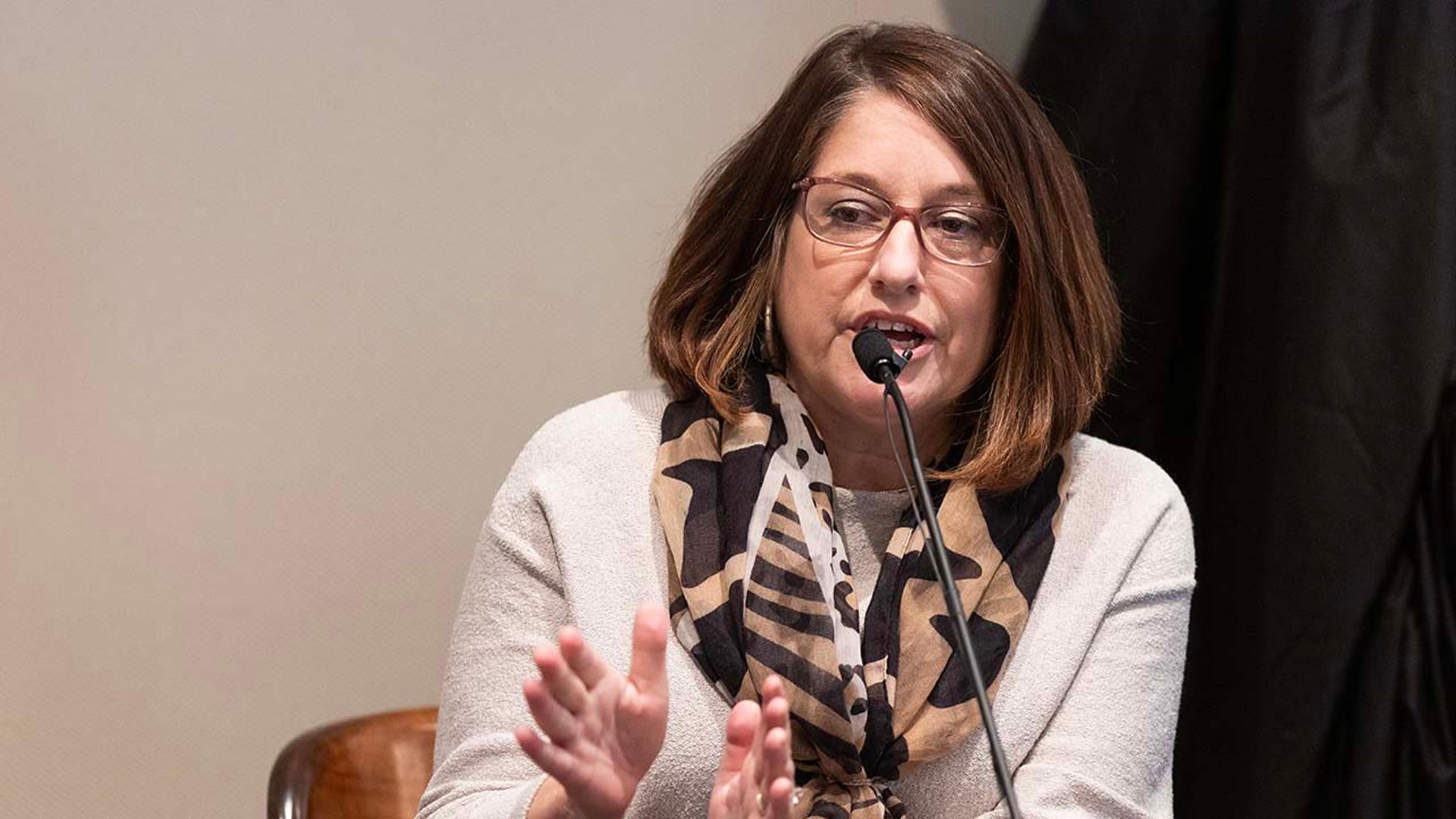 A woman testifies in court.