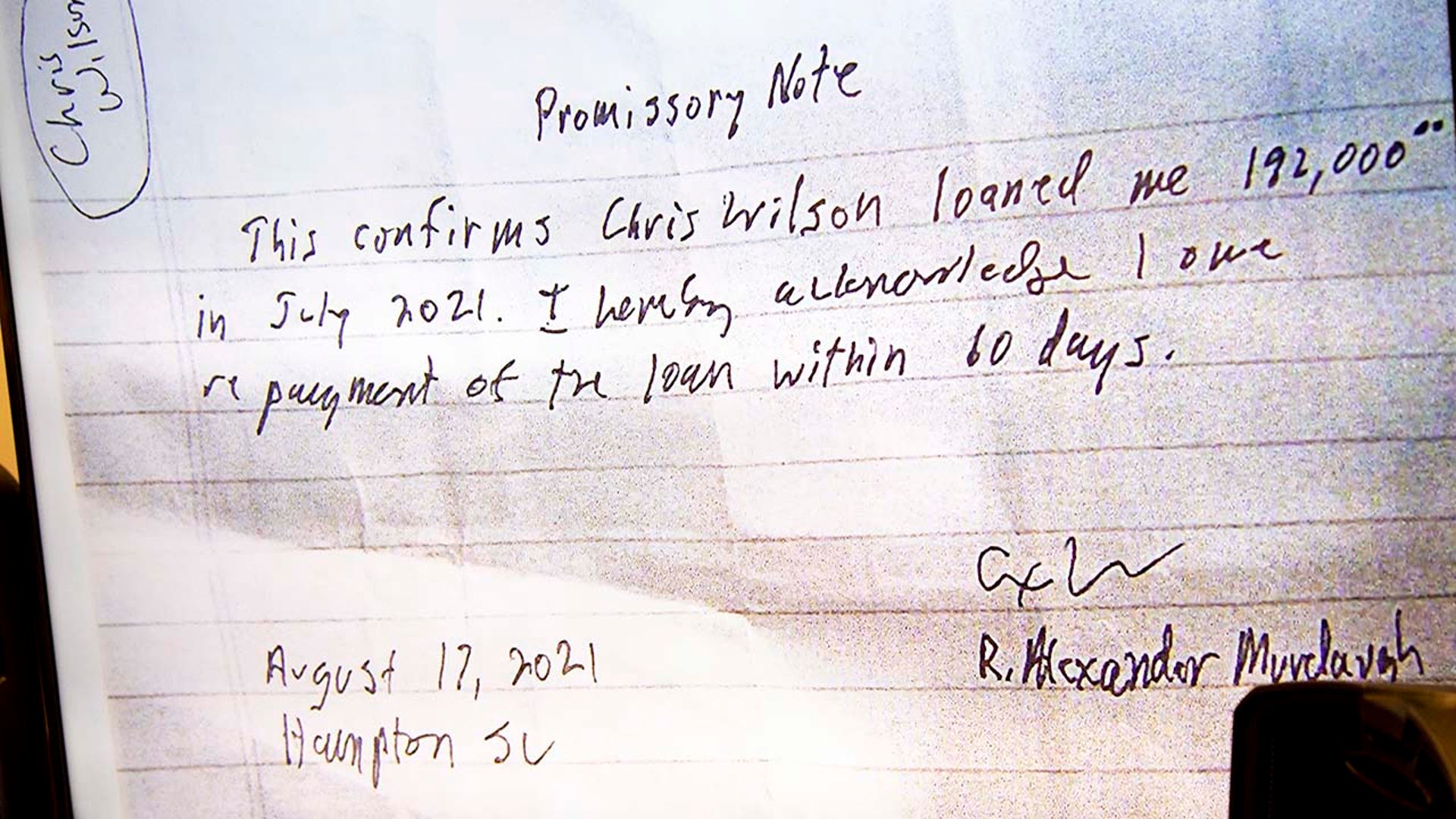 A promissory note is shown as evidence in a trial.