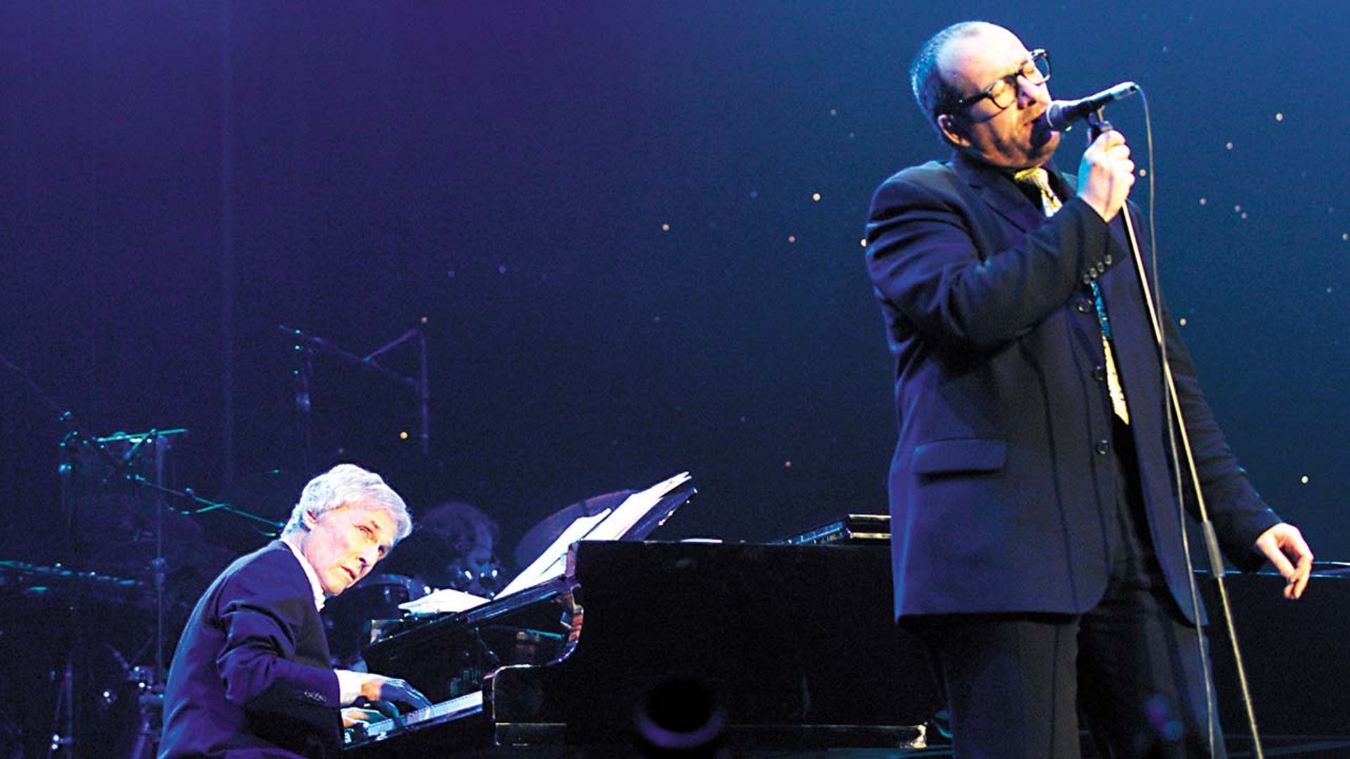 Burt Bacharach performing on stage with Elvis Costello