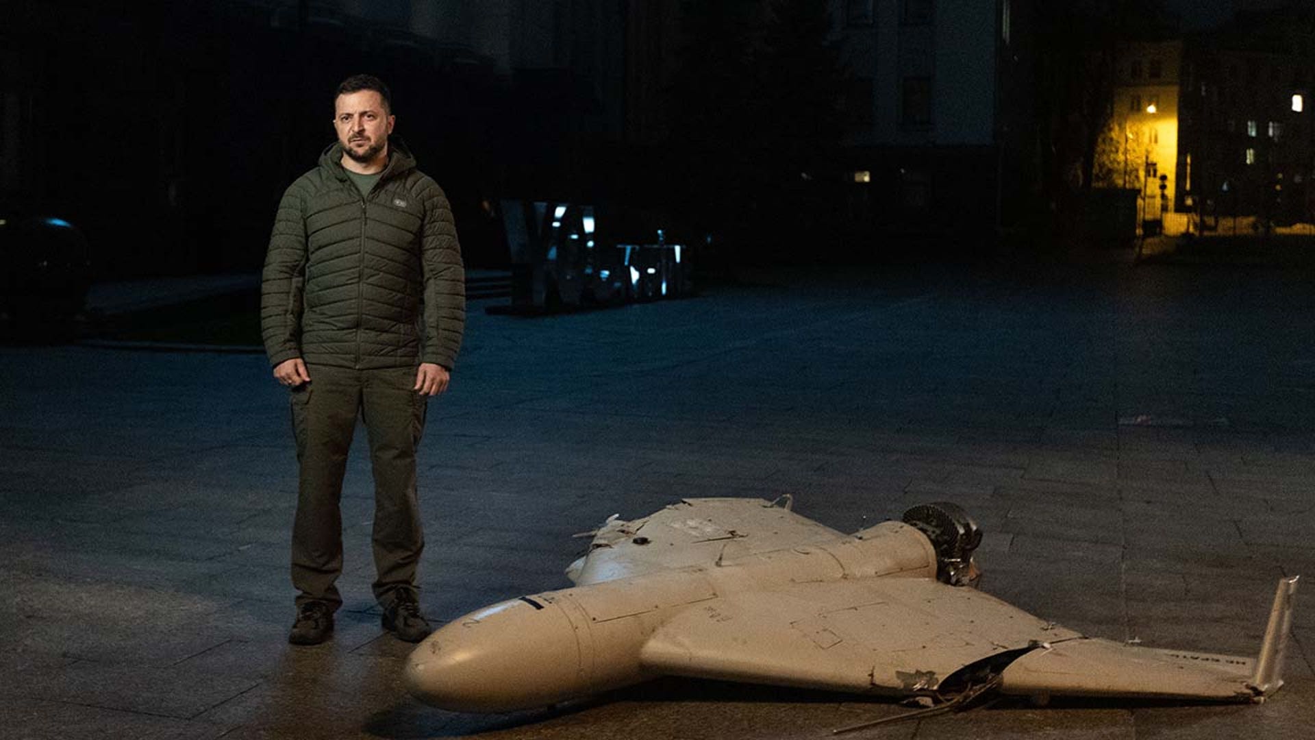 Volodymyr Zelenskyy stands next to a kamikaze drone.
