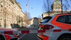 Police in Switzerland evacuate Parliament after a man bearing explosives arrested near the entrance