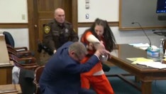 Video shows woman accused in dismemberment slaying attack her attorney in court