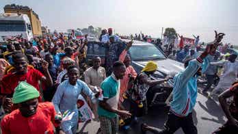 Nigerian police arrest lawmaker accused of carrying $500K in cash the day before elections