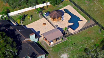Florida couple shows off backyard pool shaped like revolver: 'You swim your lap down the barrel'