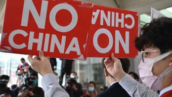 China representative invited to Taiwan by Taipei mayor met by dozens of protestors