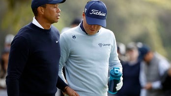 Tiger Woods appears to hand Justin Thomas a tampon after outdriving him at Genesis Invitational