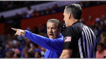 Florida fan ejected for wrapping arm around Kentucky player's neck during basketball game