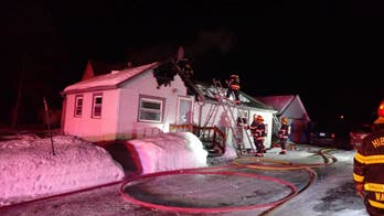 Passerby helps save sleeping residents, dog from house fire