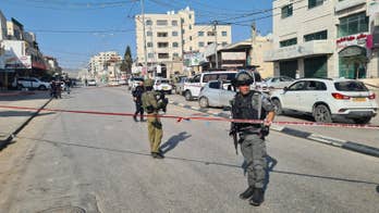 Israel calls up army battalions as serious violence hits West Bank following murder of Israeli brothers