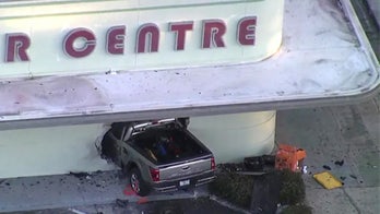 Florida pickup truck crashes into shopping center, one dead