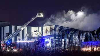 Firefighters work to extinguish fire at drone factory in Latvia