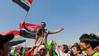 Hundreds protest in Baghdad to denounce a proposed law that would increase Iraq’s electoral district size