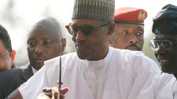 Nigerian president defends country’s redesigned currency after swapping notes led to bank closures, protests