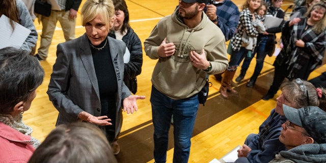 Environmental activist Erin Brockovich (R) speaks to concerned residents as she hosts a town hall at East Palestine High School on February 24, 2023 in East Palestine, Ohio.