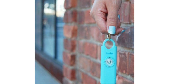 A She's Birdie keychain that emits an alarm and strobe light when activated.