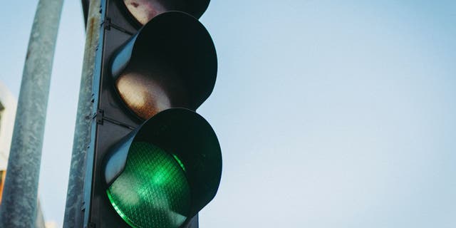 Adding a fourth traffic light may be beneficial for traveling time.