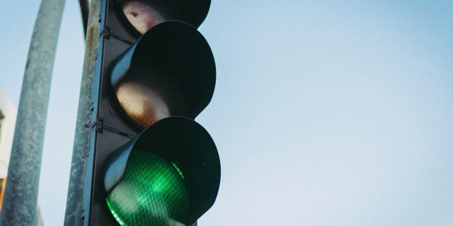 Adding a fourth traffic light may be beneficial for traveling time.