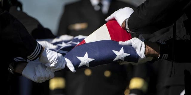 Sailors from the U.S. Navy Ceremonial Guard and the U.S. Navy Ceremonial Band conduct military funeral honors for U.S. Navy Gunner’s Mate 3rd Class Herman Schmidt in Section 70 of Arlington National Cemetery in Arlington, Va., Feb. 23, 2023.