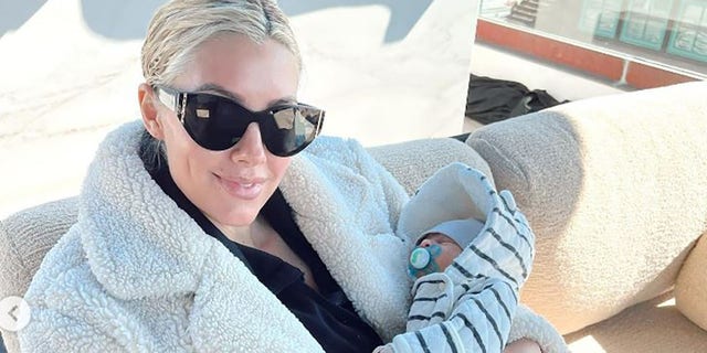 Tristan, 3 weeks, is Heather Rae Young's first baby. She married Tarek El Moussa in 2021. 