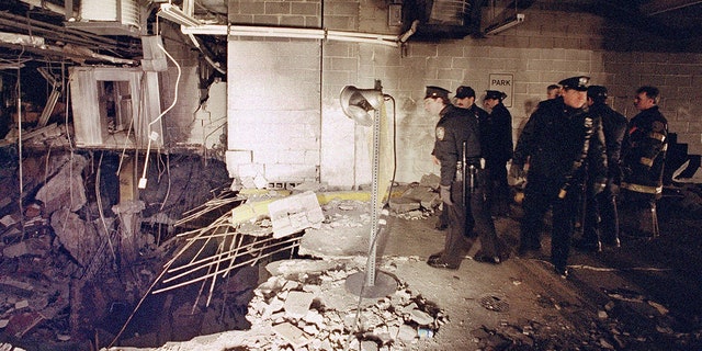 New York City constabulary and firefighters inspected nan explosive crater wrong an underground parking car shed of New York's World Trade Center connected Feb. 27, 1993, nan time aft an detonation tore done it. 