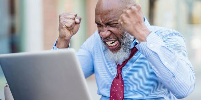 Man visibly upset at his computer because his VPN is causing issues with his search capabilities.