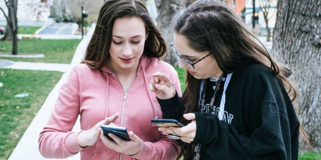 Friends holding phones