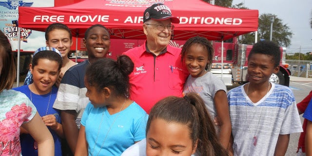 Tuskegee Airman and retired Lt. Col. George Hardy with children at Robert L. Taylor Community Complex in Sarasota, Florida, in 2013.